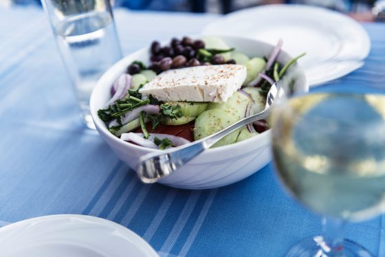 Healthy greek salat on the plate with vegetables and feta cheese, Greece