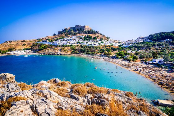 Lindos whitewashed village in Rhodes Island, Greece - summertime holiday destination.